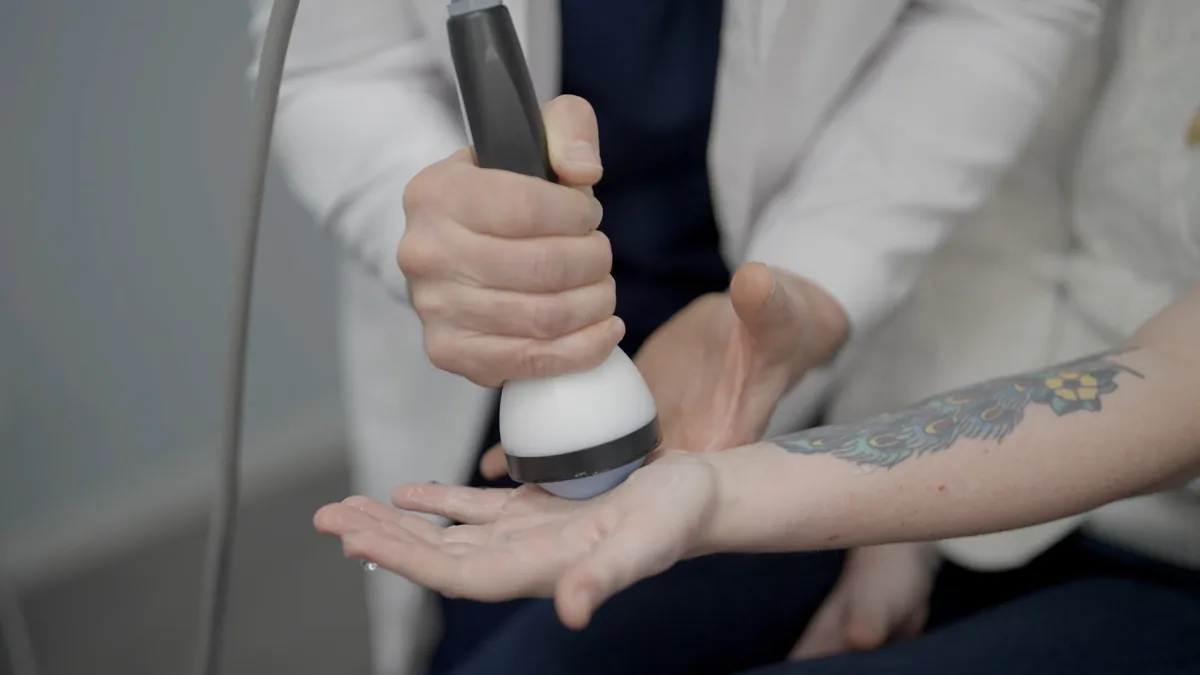 StemWave applicator held on the palm side of the wrist