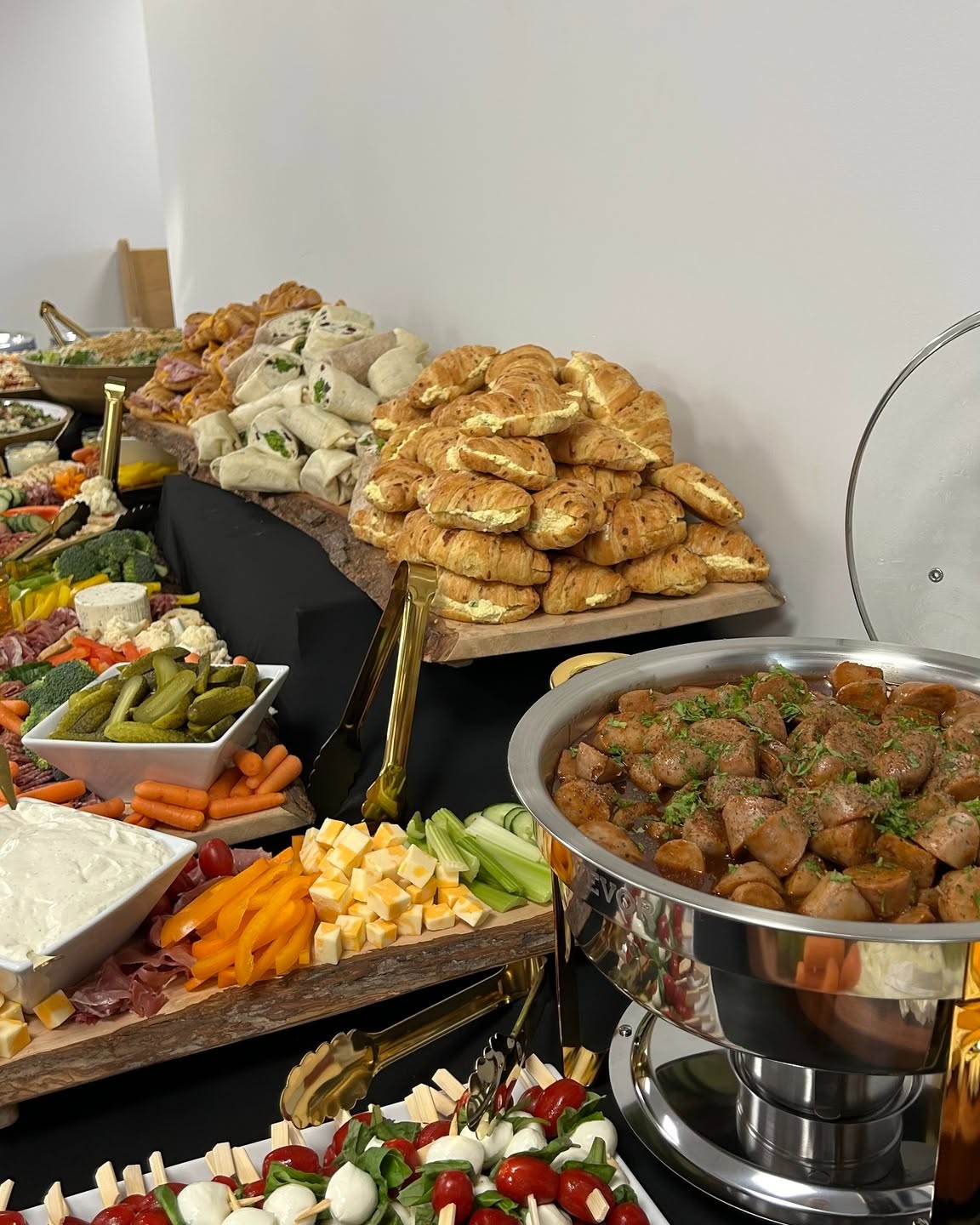 Table set with charcuterie, pickles and caprese skewers prepared by Chef Seb