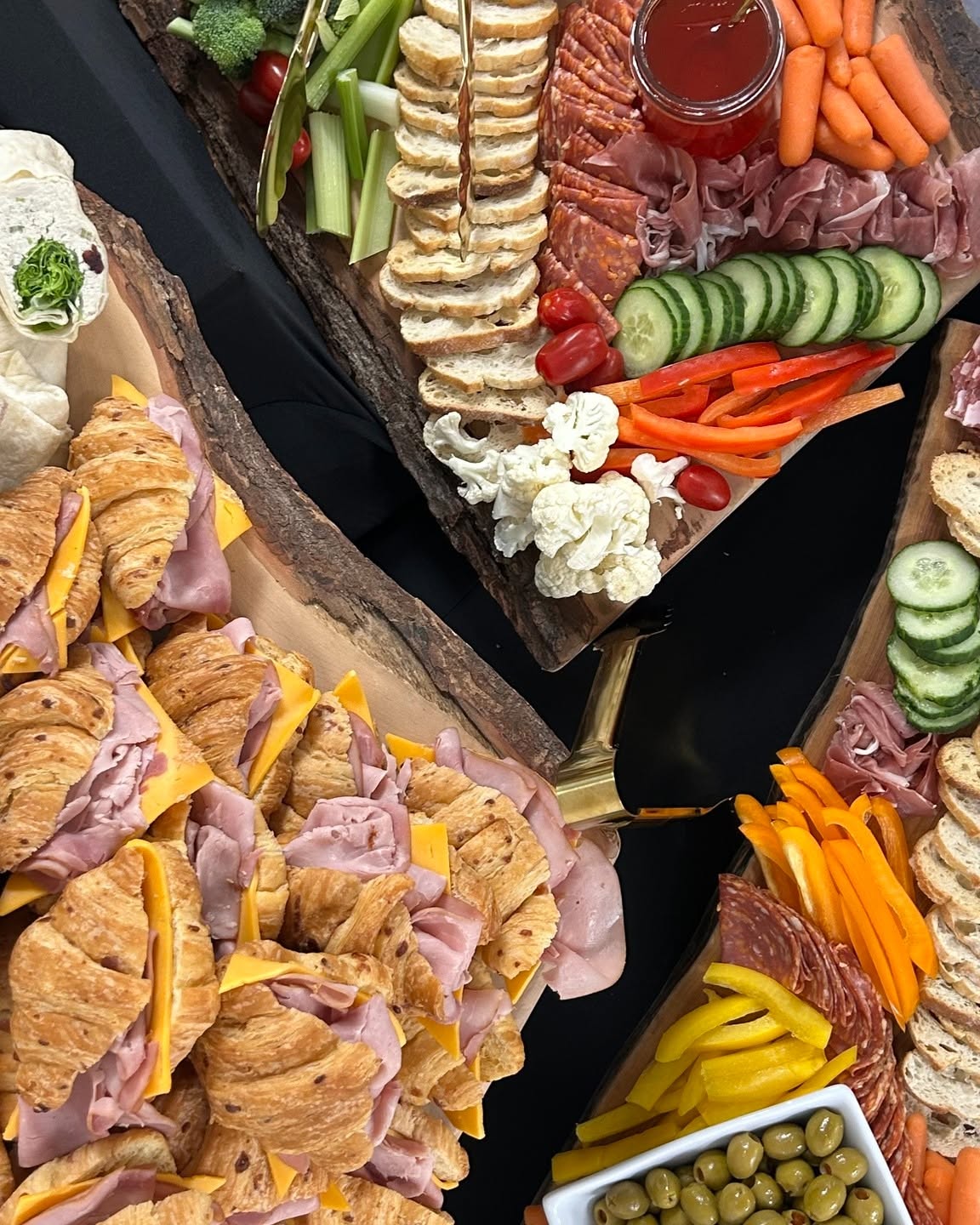 Sandwiches and a charcuterie board, viewed from above