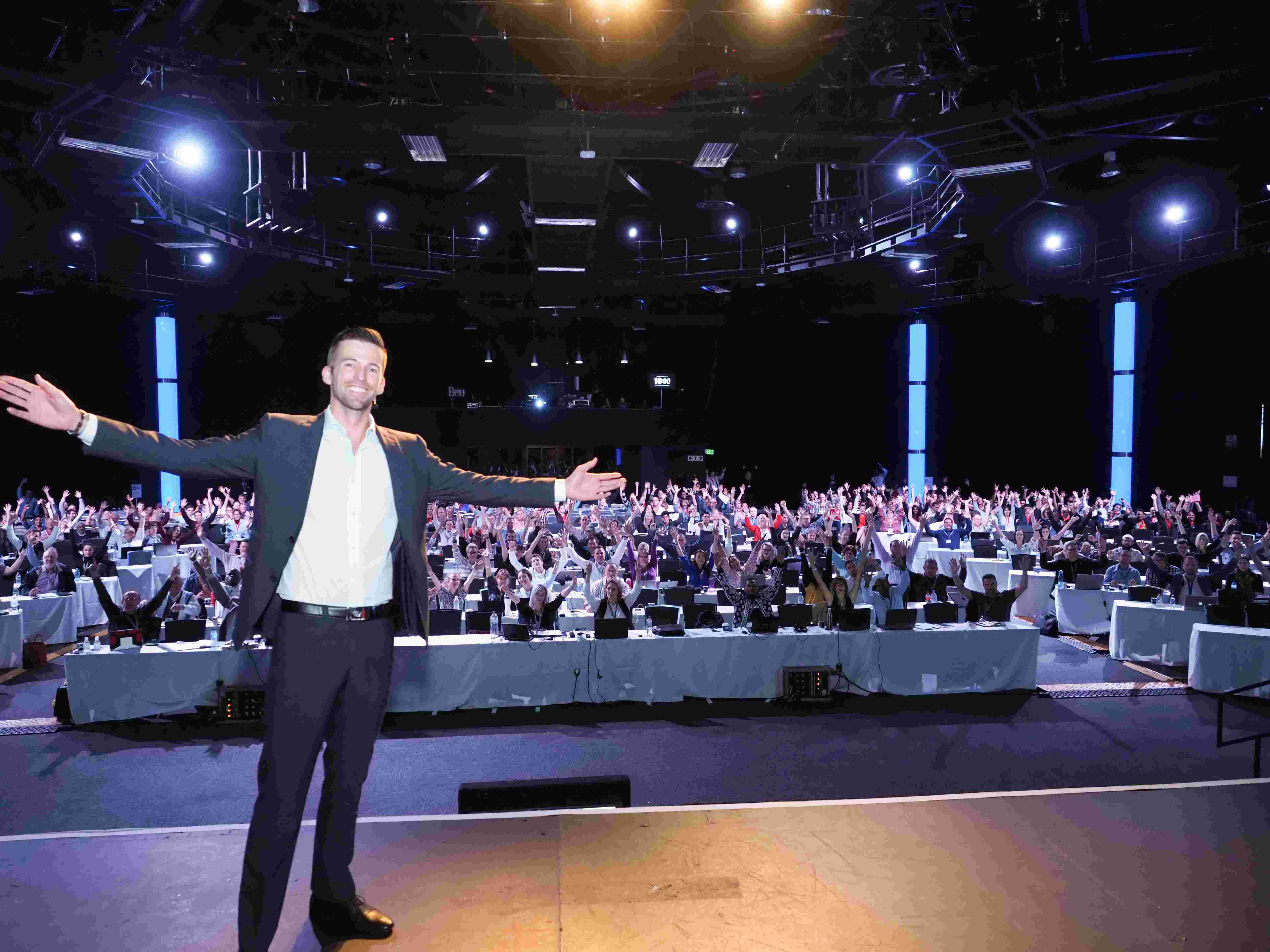 Matt Clark speaking on stage