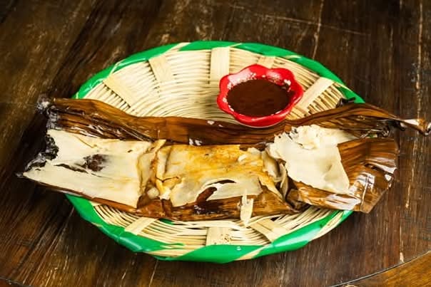 Tamales Oaxaqueños wrapped in banana leaf at Oaxaca de Mis Amores