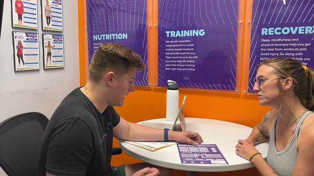Coach working with a member at Anytime Fitness Columbia