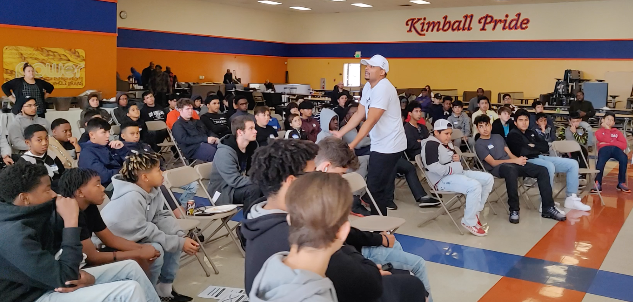 Elijah Kai facilitating a discussion with a room of teenagers