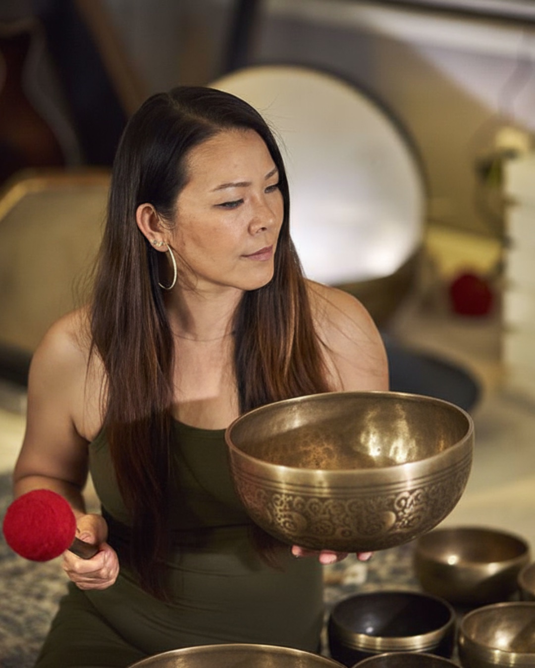 Riya Wang holding a Tibetan Singing Bowl