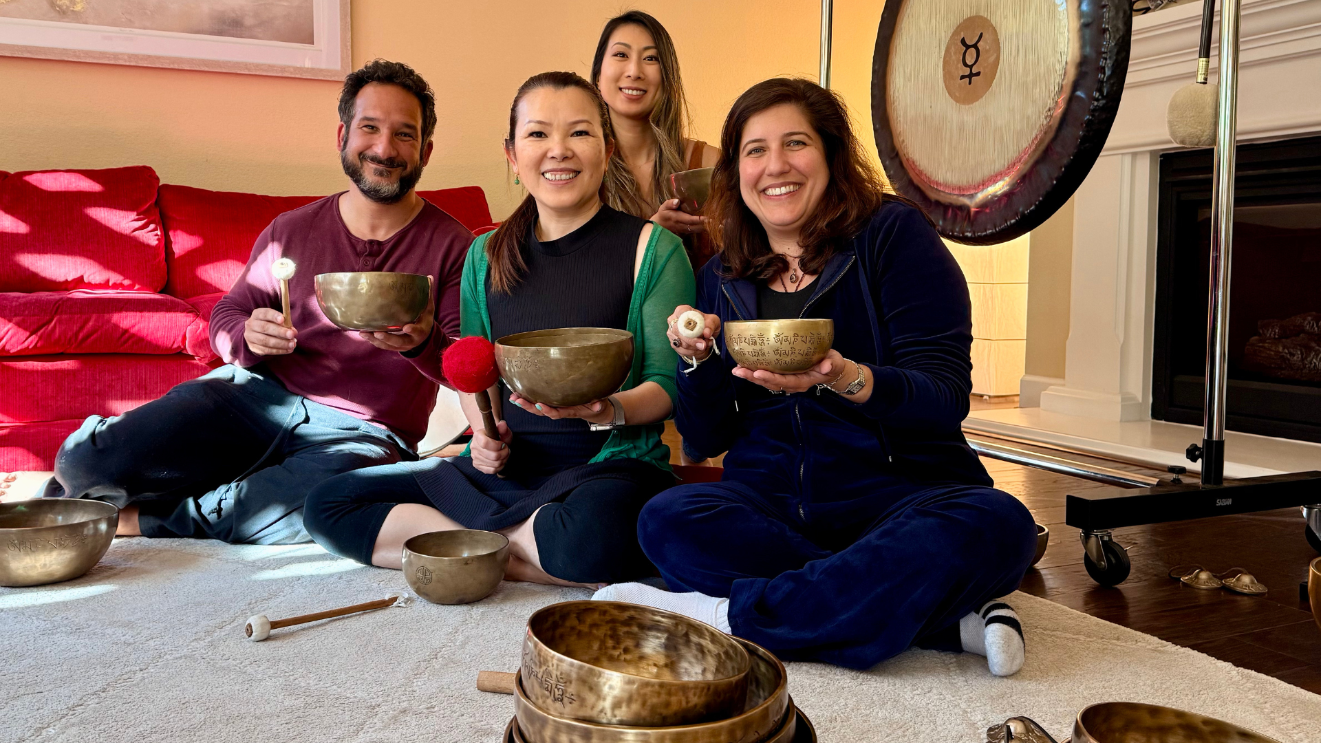 Six members of the Zenquency community practicing with Tibetan Singing Bowls