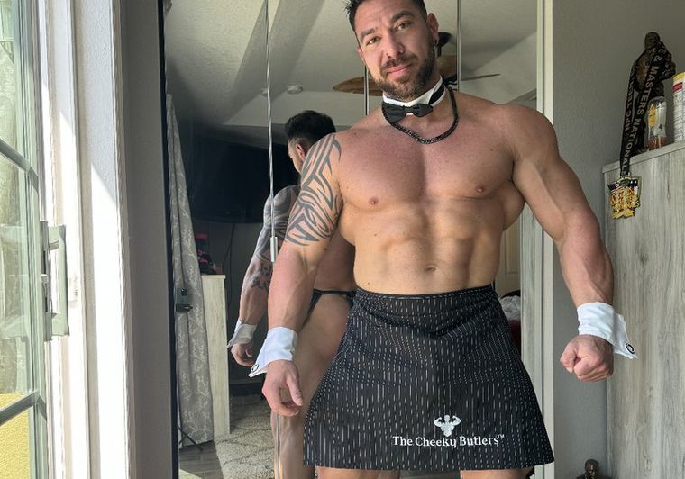 A Cheeky Butler in bow tie and the signature pinstripe apron