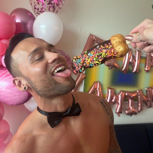 A Cheeky Butler at a birthday party with balloons