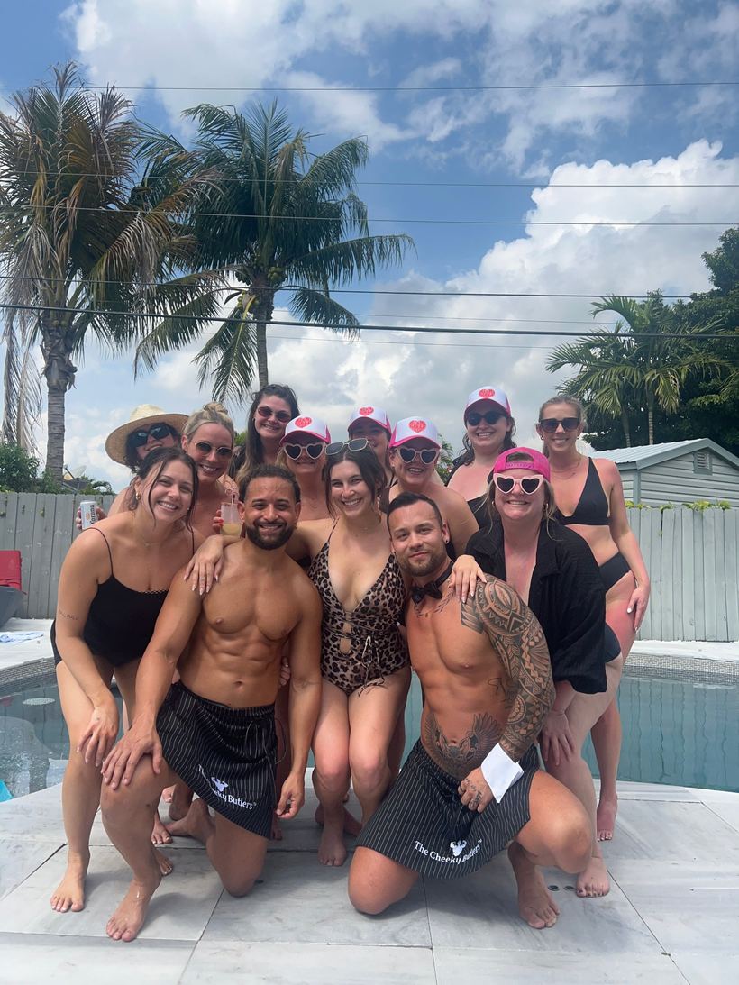 A group of friends day-drinking outdoors with two Cheeky Butlers