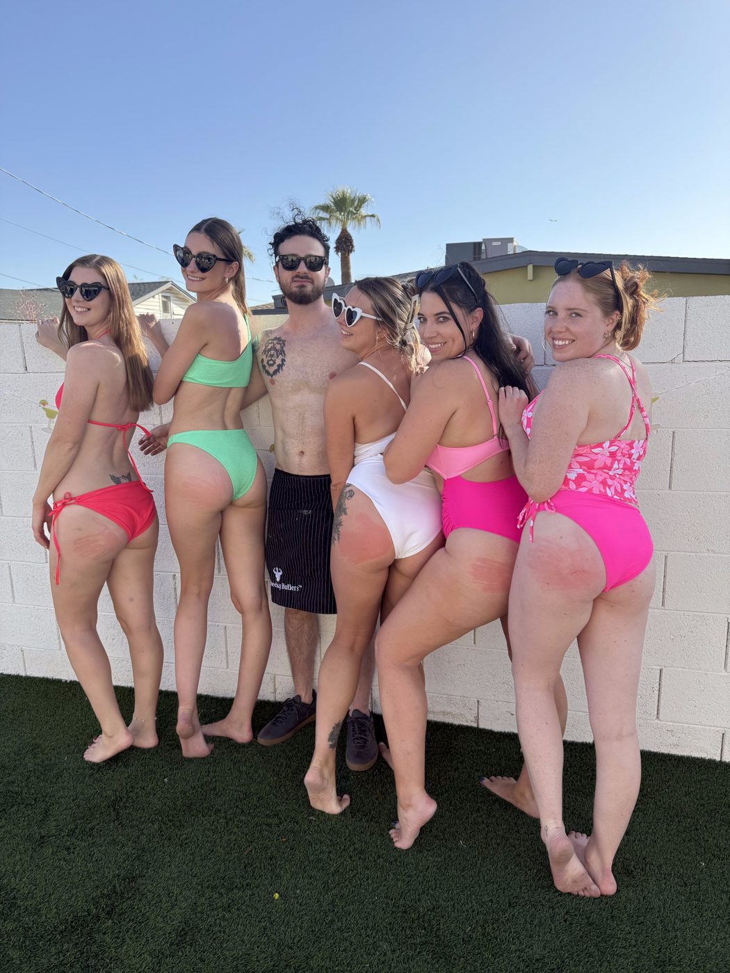 Friends celebrating at a divorce party with a Cheeky Butler