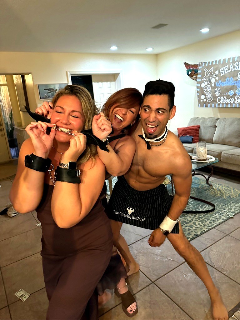 Cabana boy celebrating with guests at a birthday party