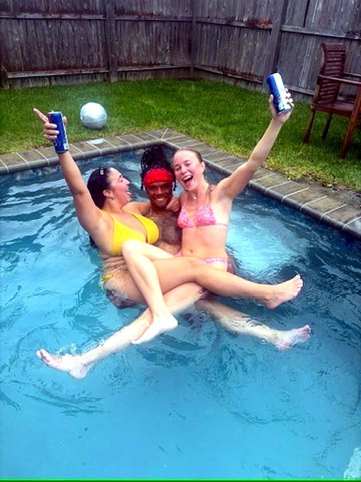 Girls trip pool day, friends in the pool with drinks