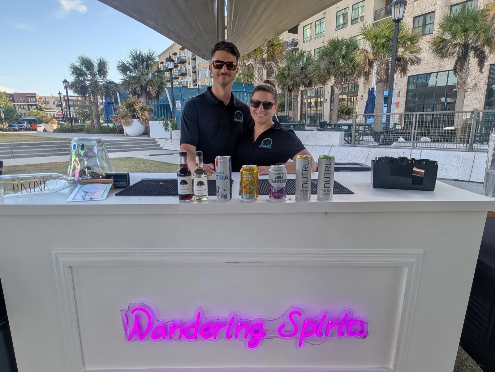 A mobile bar and Cheeky Butlers set up for a Savannah bachelorette