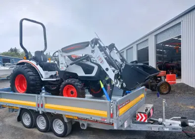 Grass and Gravel tractor on trailer