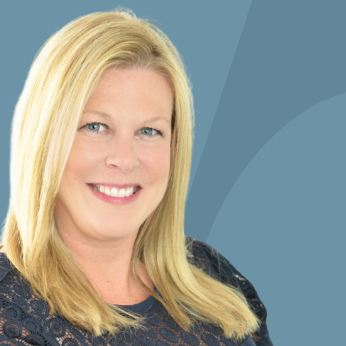 Smiling woman with blonde hair and blue eyes, representing the Mary Ellen Vanaken Team for real estate consultations in North Atlanta.