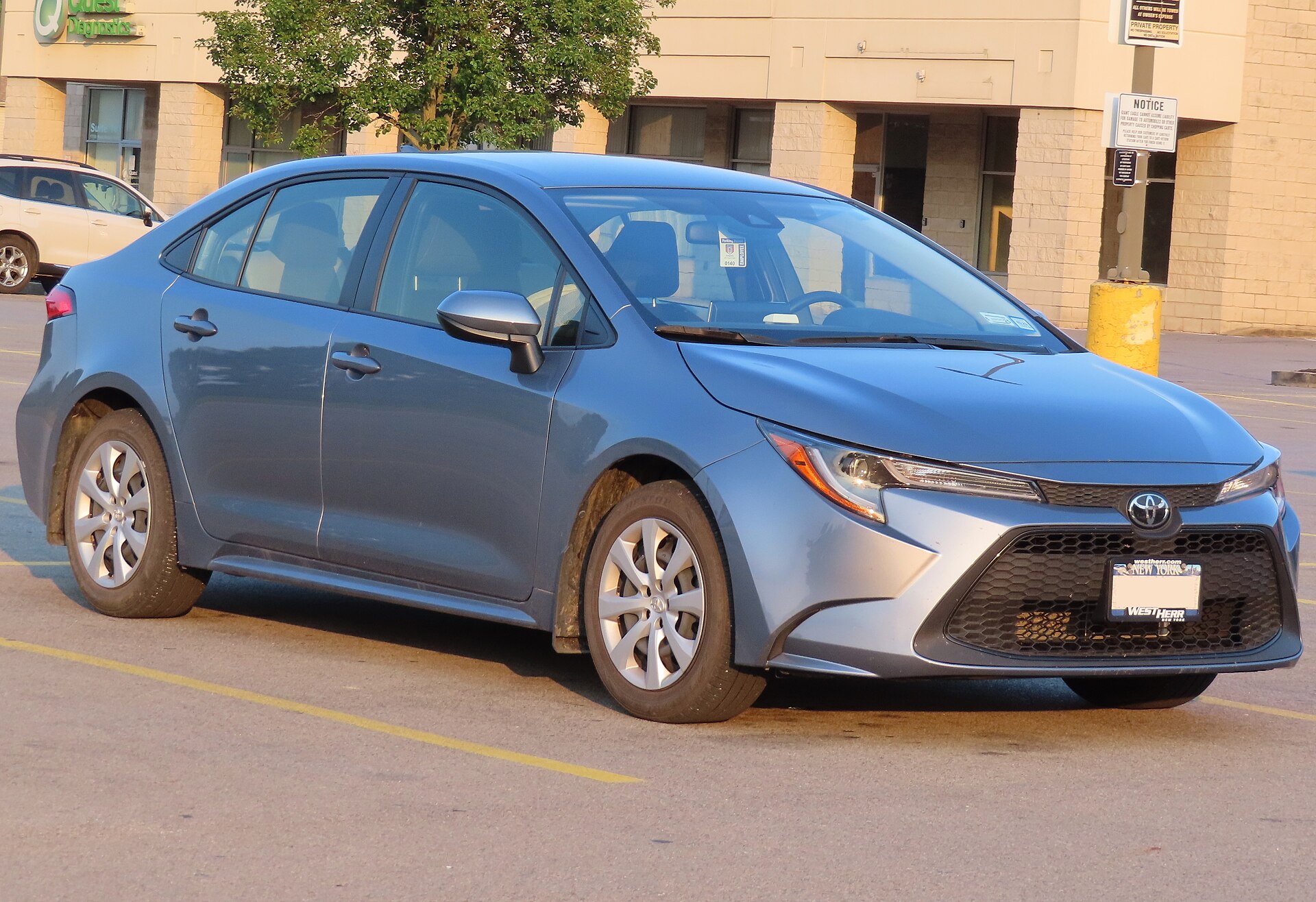 A Toyota Corolla LE sedan, front three-quarter view