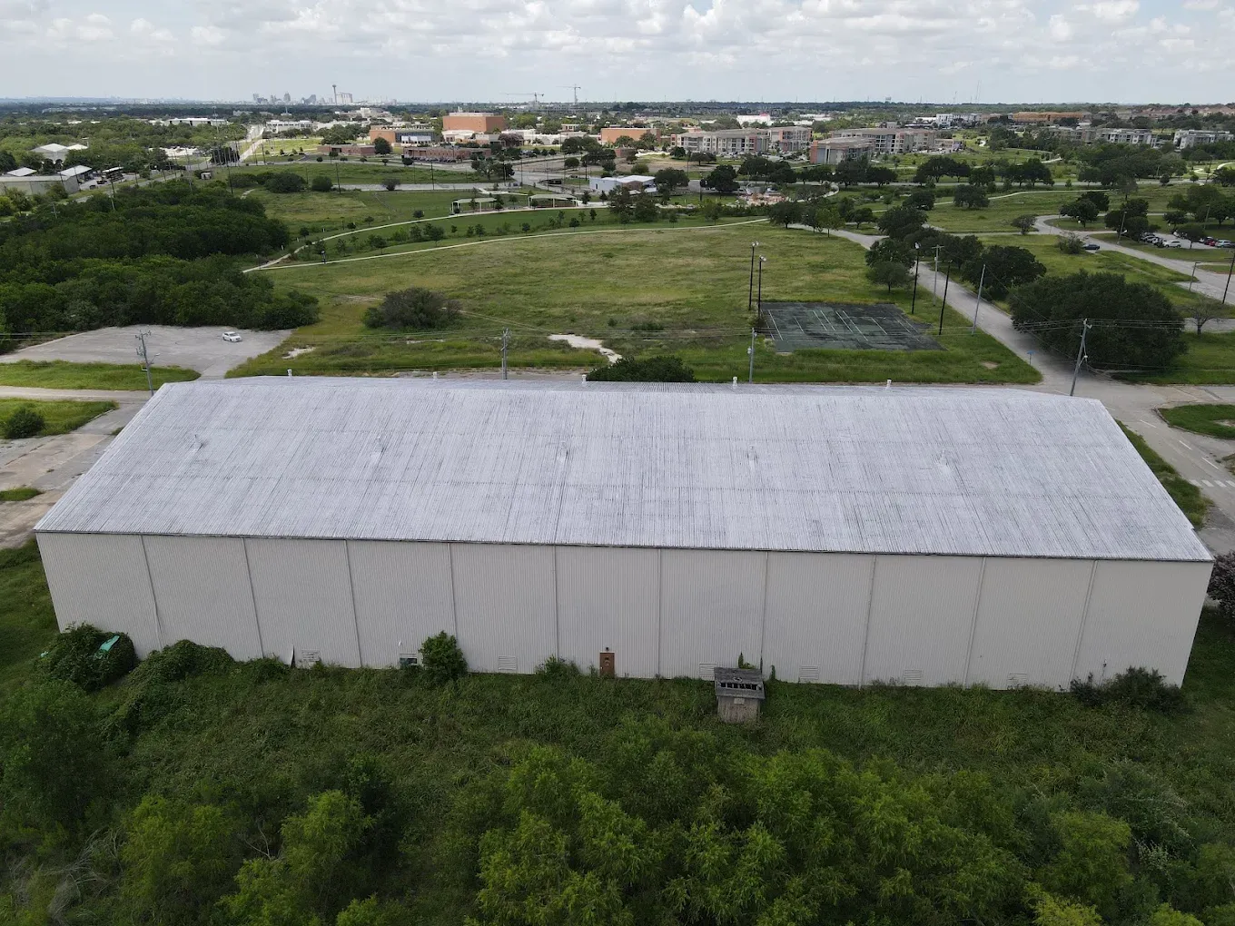 Commercial drone services San Antonio retail shopping center aerial overview parking lot and building footprint