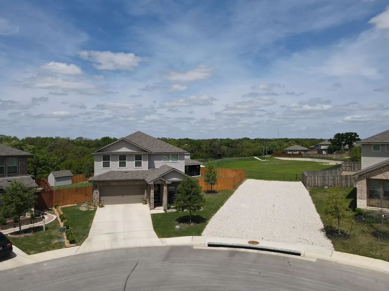 Real estate drone photos San Antonio luxury home exterior aerial front elevation view showcasing premium residential architecture