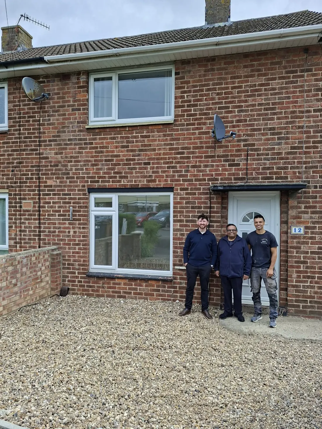 Rajesh Shah with Joe Martin outside his investment property