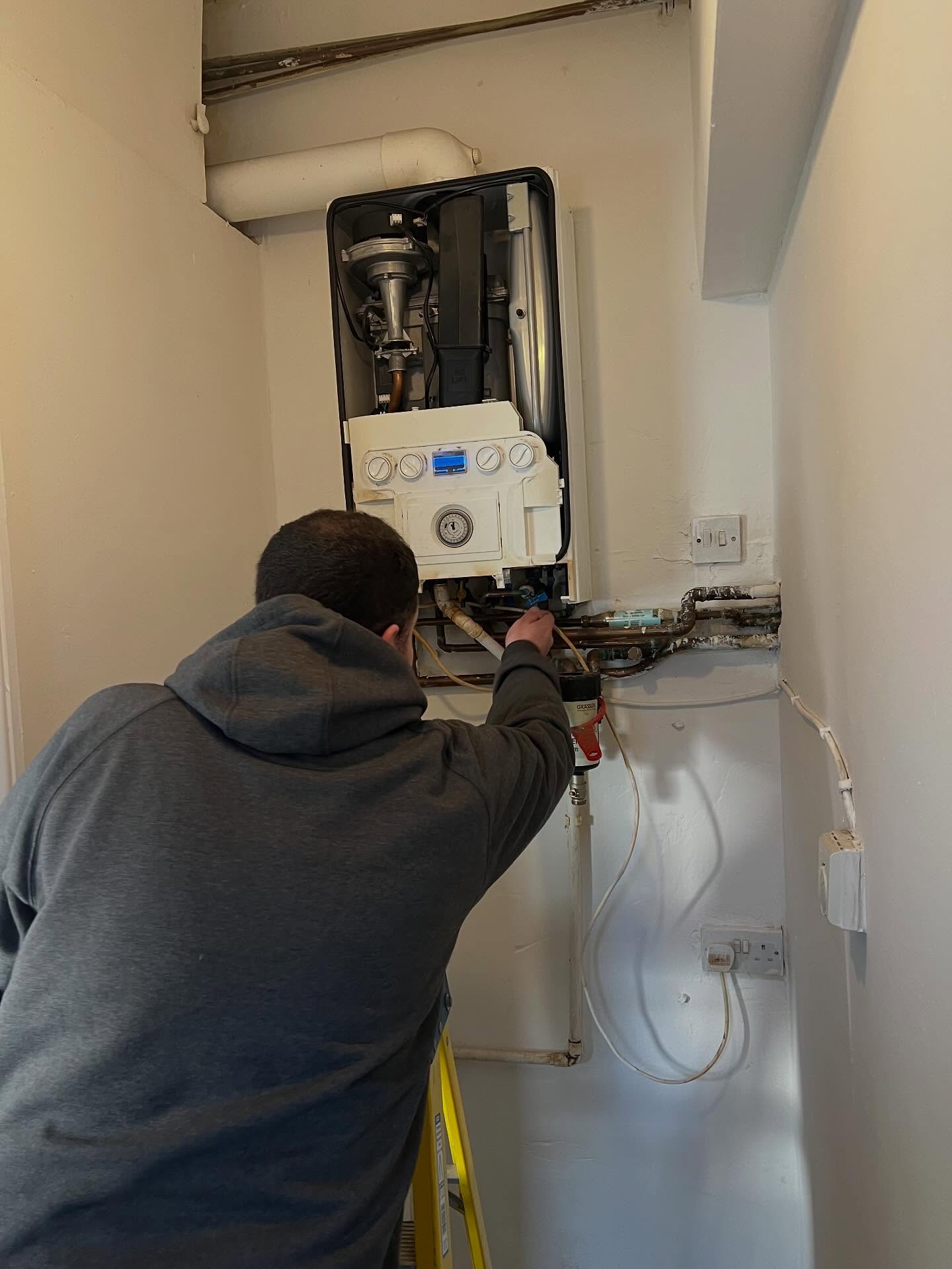 Plumber working on an East Midlands refurbishment