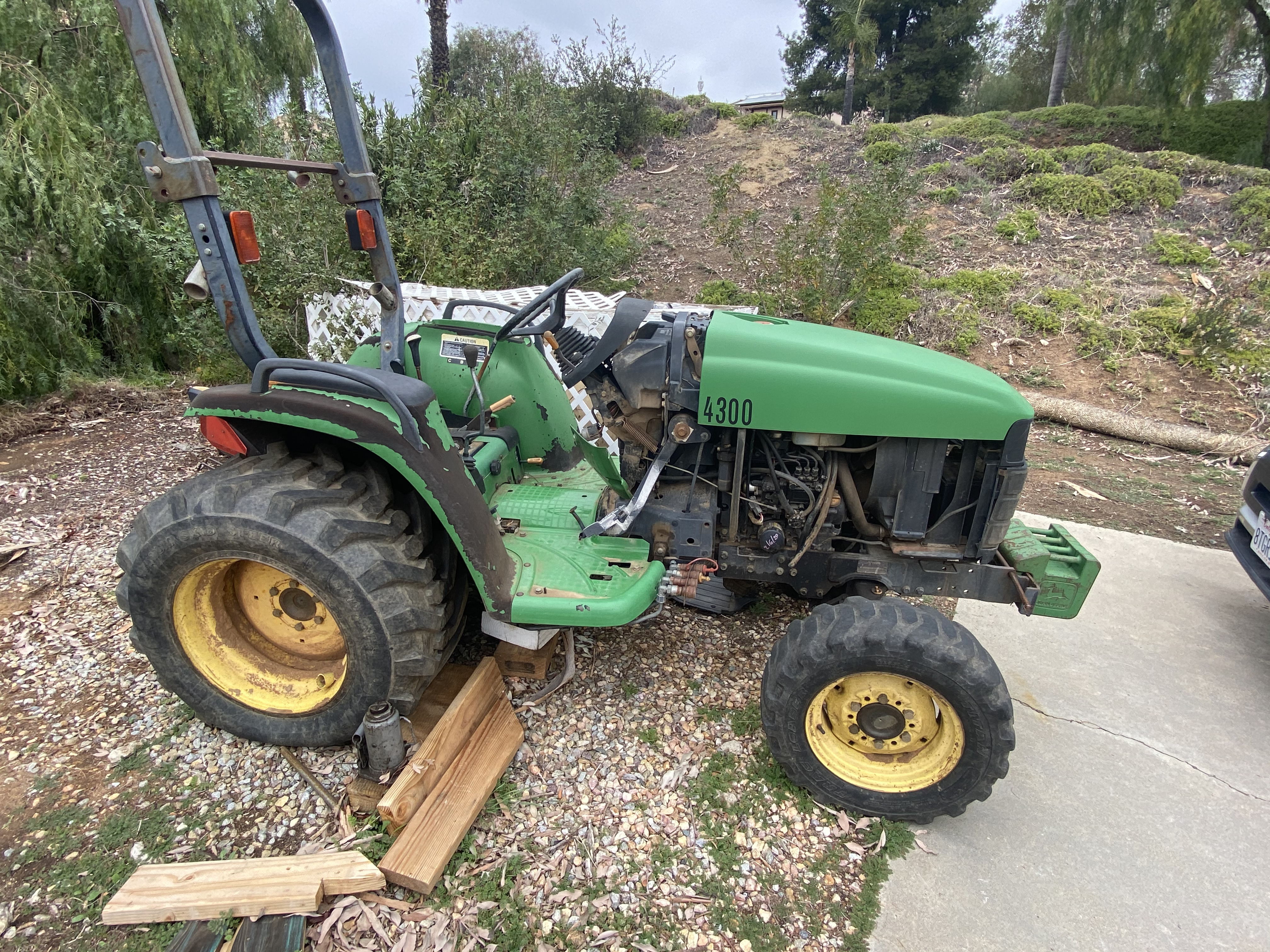 John Deere 4300 tractor fully opened for service