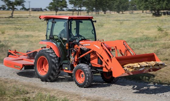 Kubota L series tractor with loader working in field