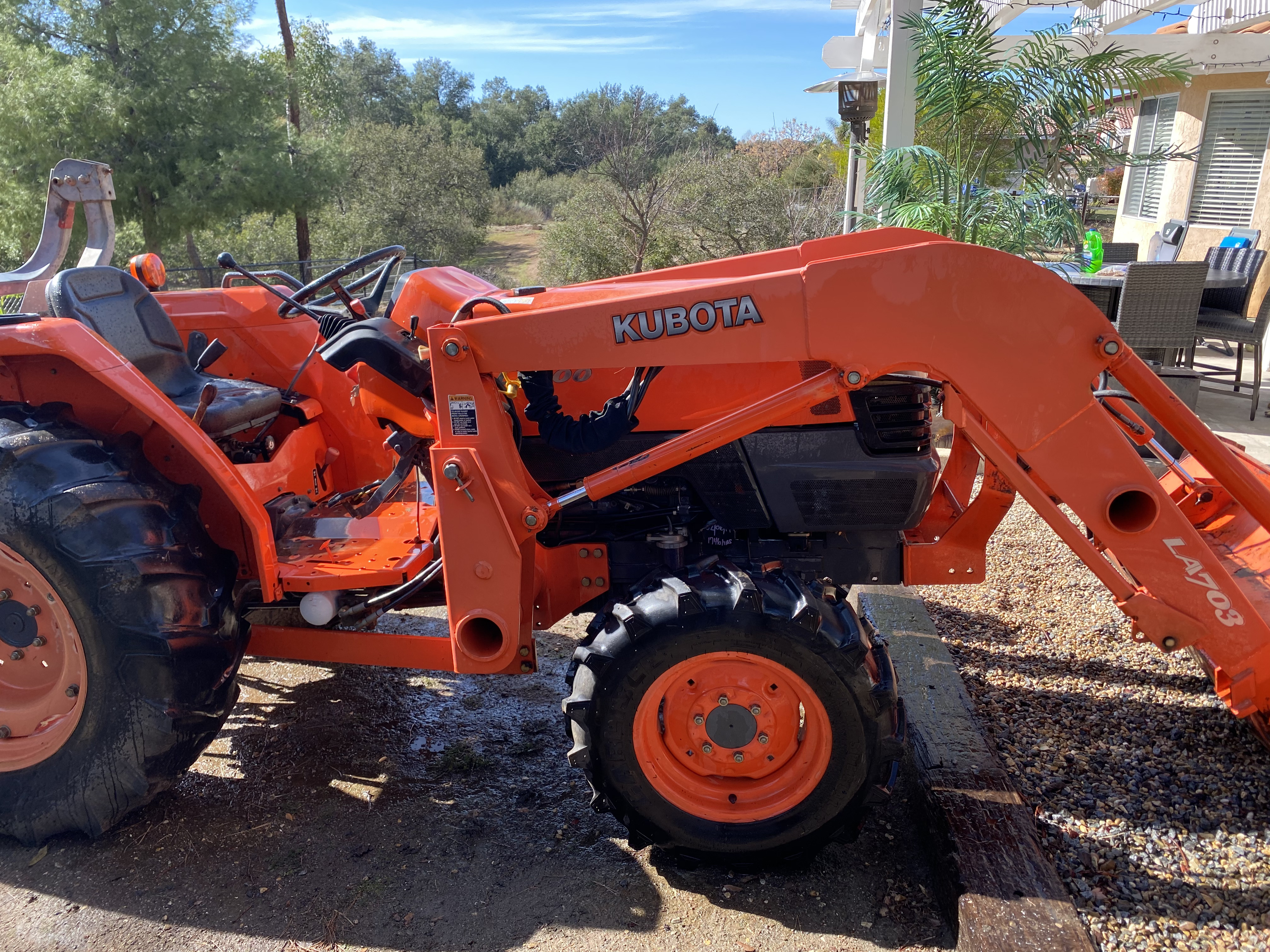 Kubota tractor with open engine at a San Diego County repair job
