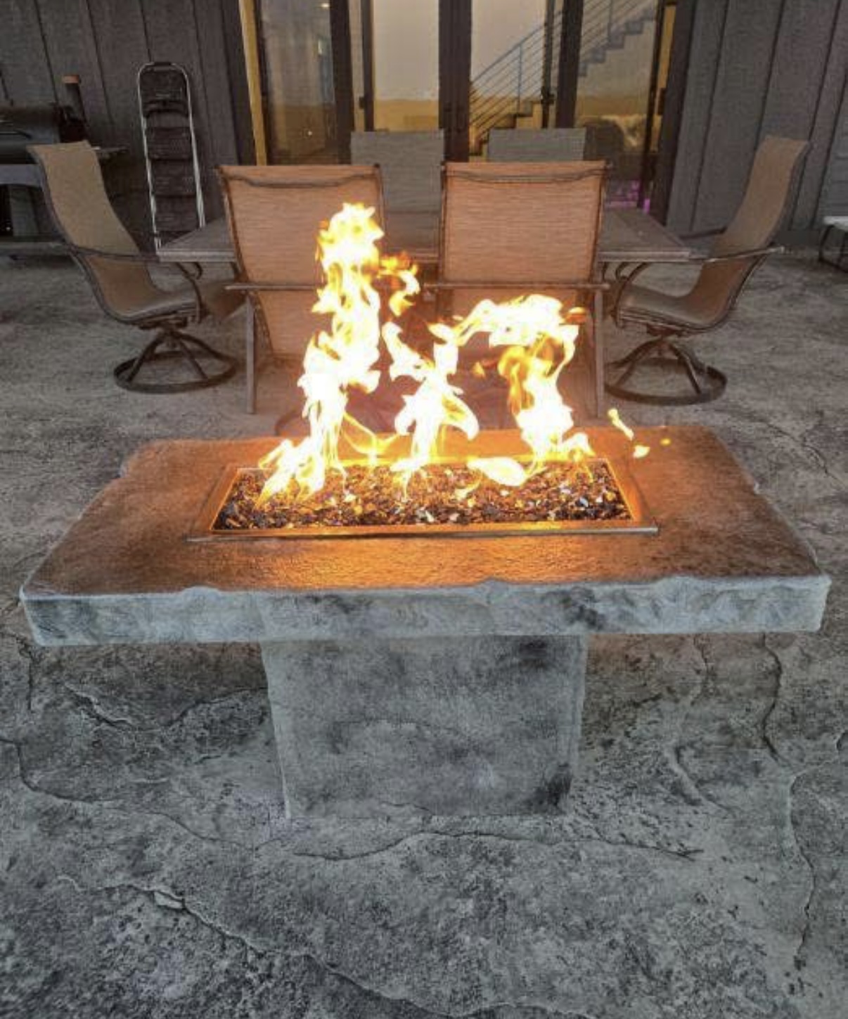 Lit Stone Fire Pit Table