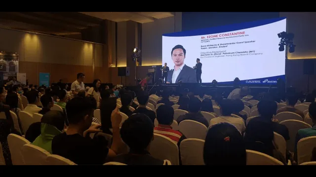 Ezone Constantine speaking at a live event