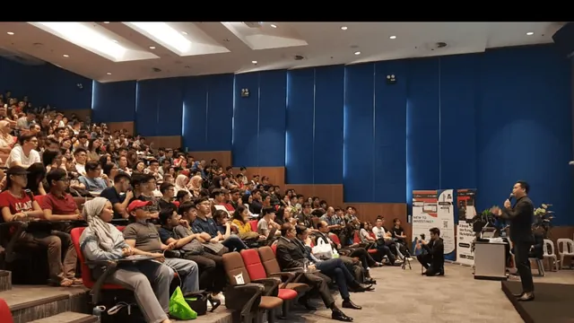 Ezone Constantine speaking at a live event