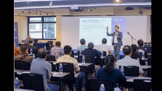 Ezone Constantine speaking at a live event