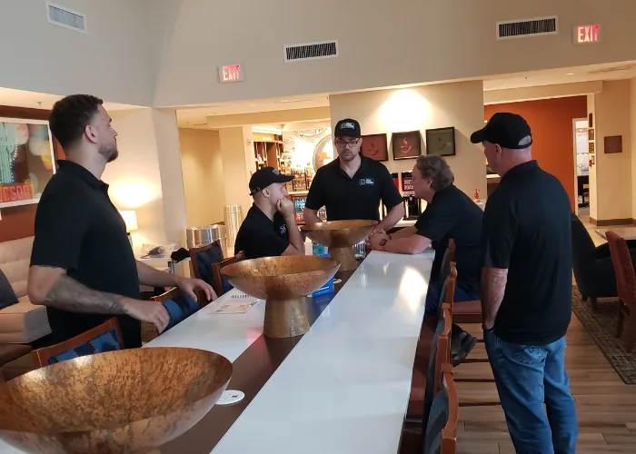Professional poker instructor leading a corporate event ideas strategy session for executive team building