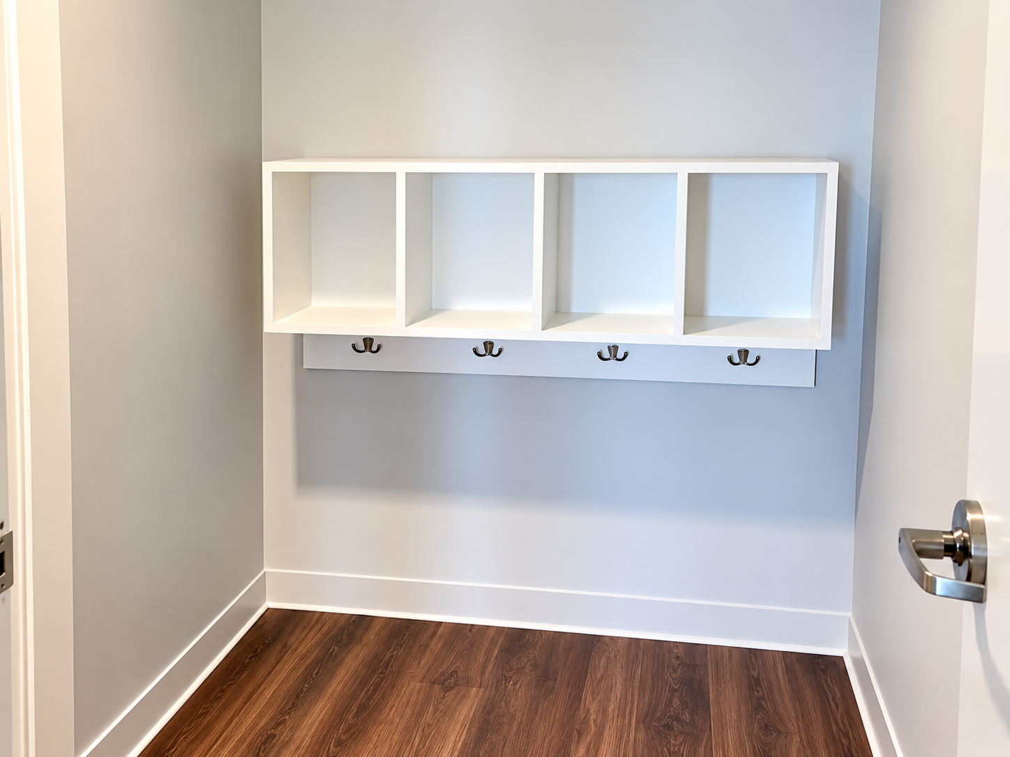 Kean University - Suite entry nook with built-in cubbies and hook rack detailed