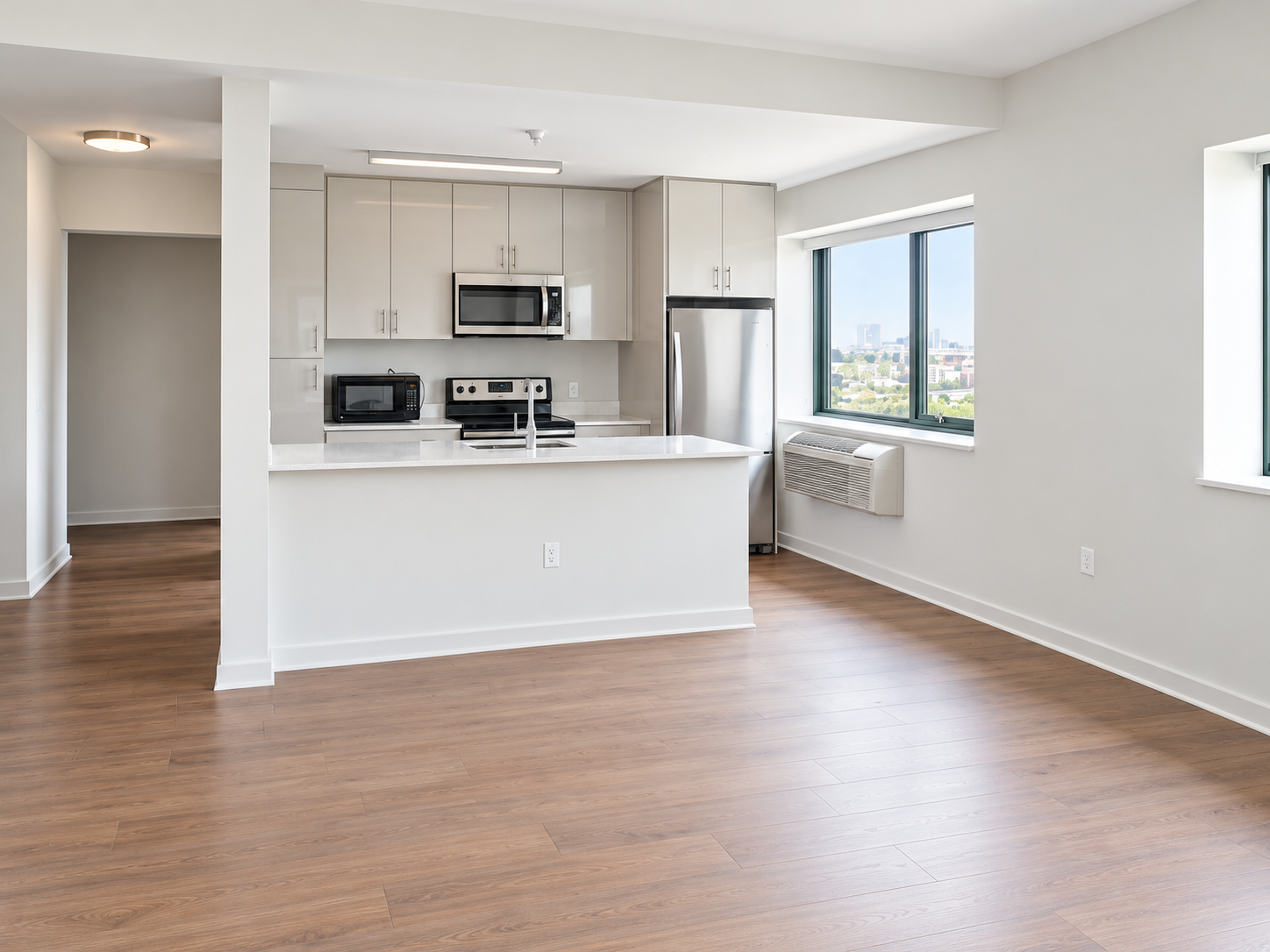 Marin Boulevard - Open-concept living room and kitchen island with skyline view