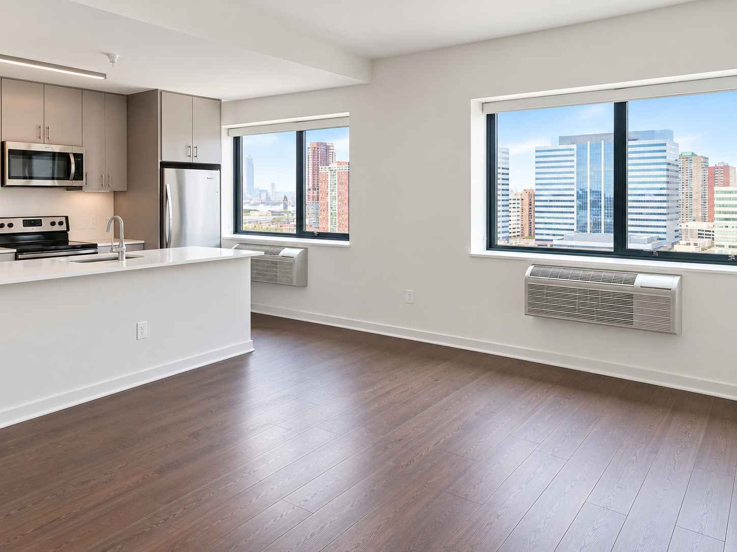 Marin Boulevard - Spacious living area with polished hardwood flooring and city views