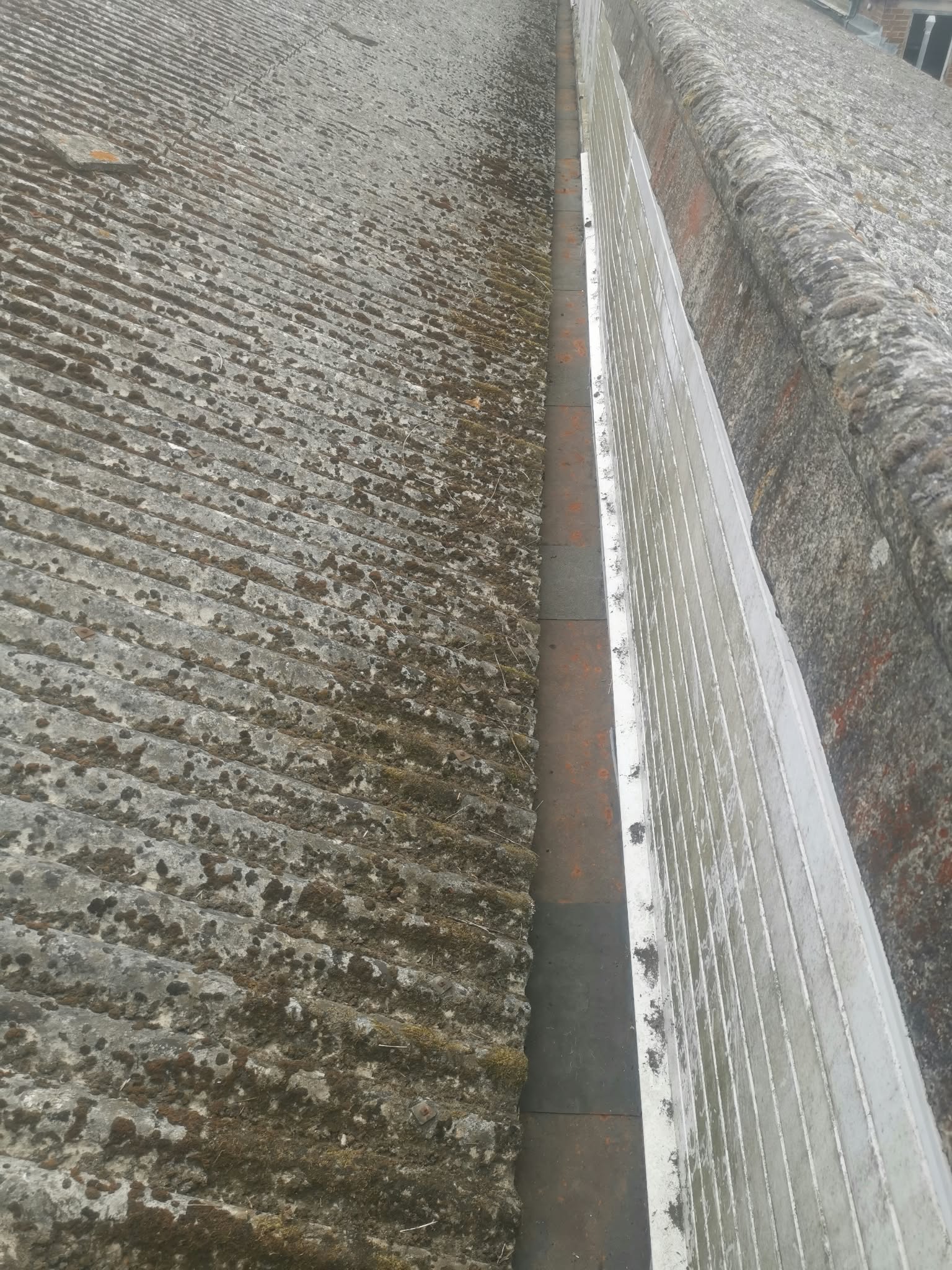 The same valley gutter cleared after cleaning