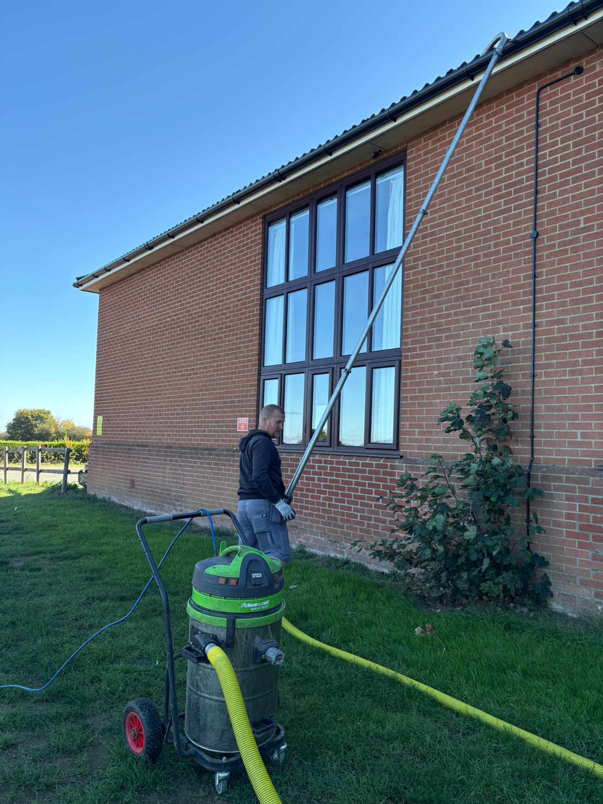 Gutter vacuum system set up on a job