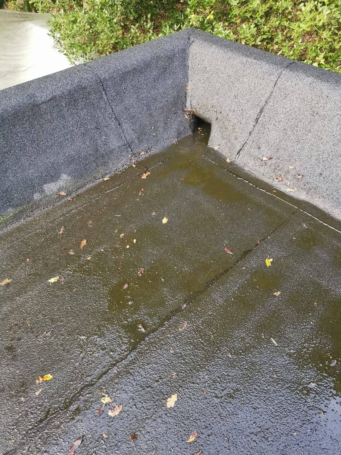 The same flat roof outlet cleared after cleaning