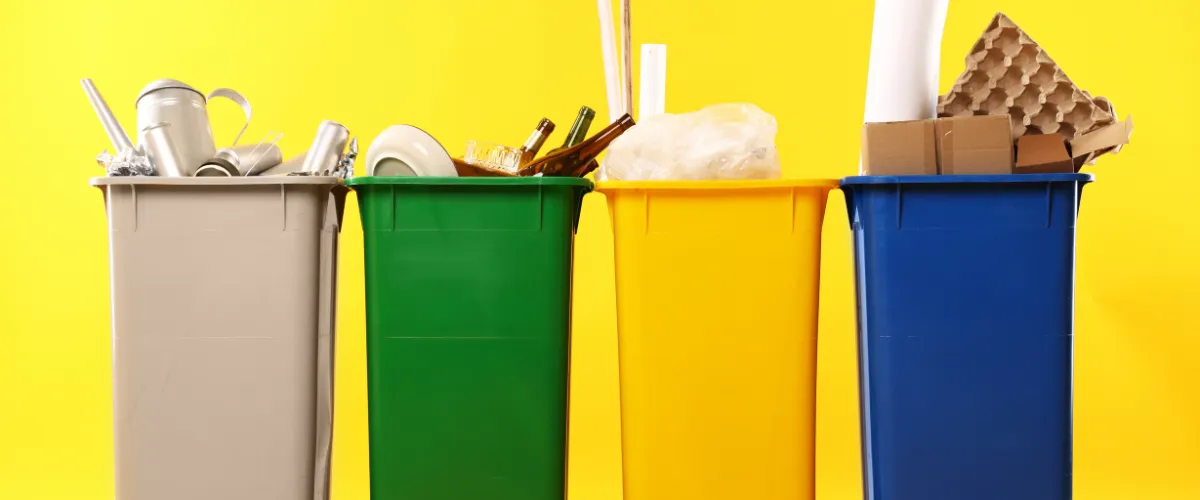 Colorful recycling bins representing different types of waste
