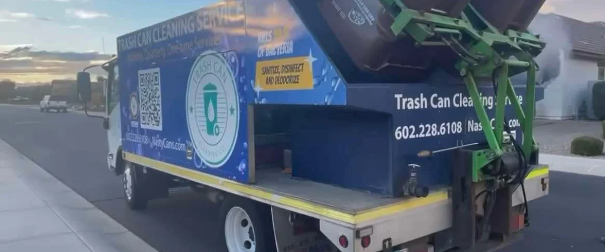 Two Nasty Cans trash can cleaning service trucks, a large blue one and a smaller green one, parked on a sunny residential street. Two Nasty Cans trash can cleaning service trucks, a large blue one and a smaller green one, parked on a sunny residential street.