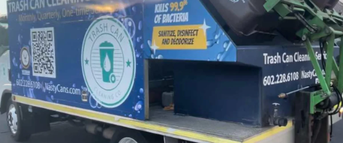 Side view of a blue and white 'Nasty Cans' trash can cleaning service truck with phone number and QR code. Side view of a blue and white 'Nasty Cans' trash can cleaning service truck with phone number and QR code.