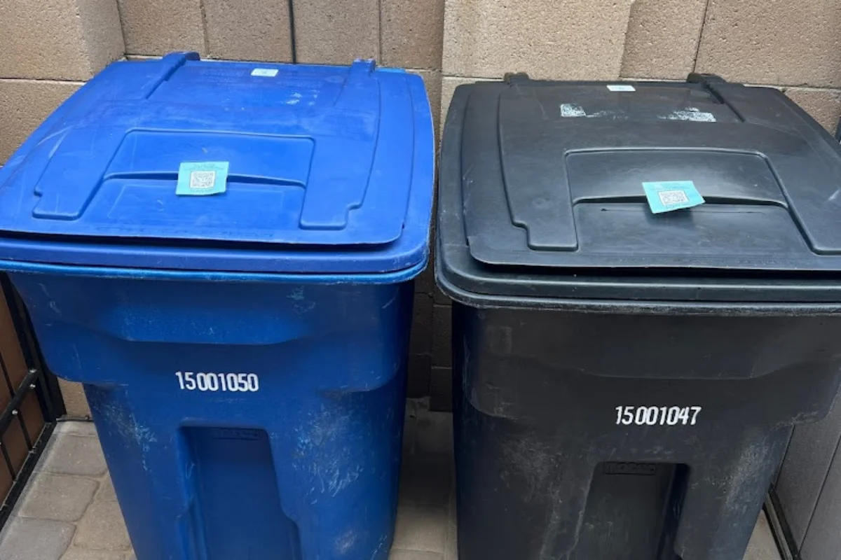 blue an black wate bins. blue an black wate bins.
