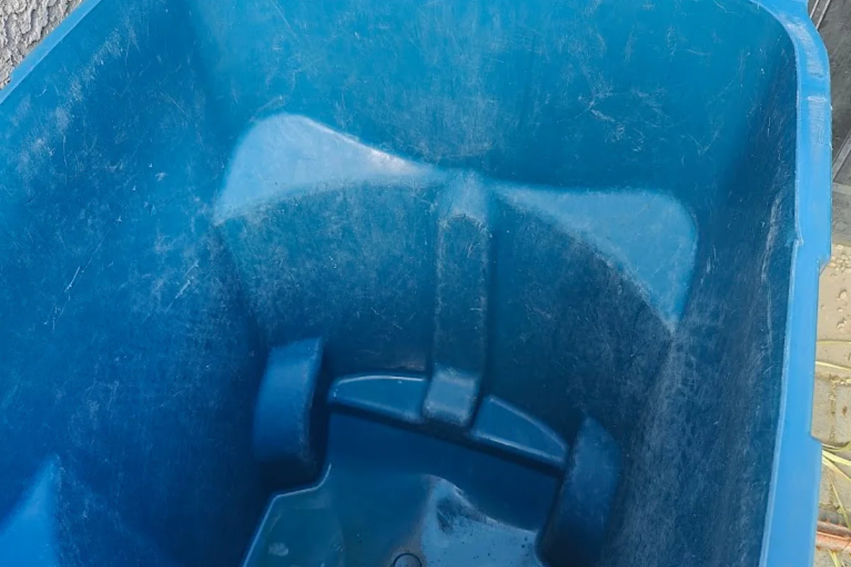 dirty blue plastic bins interior. dirty blue plastic bins interior.