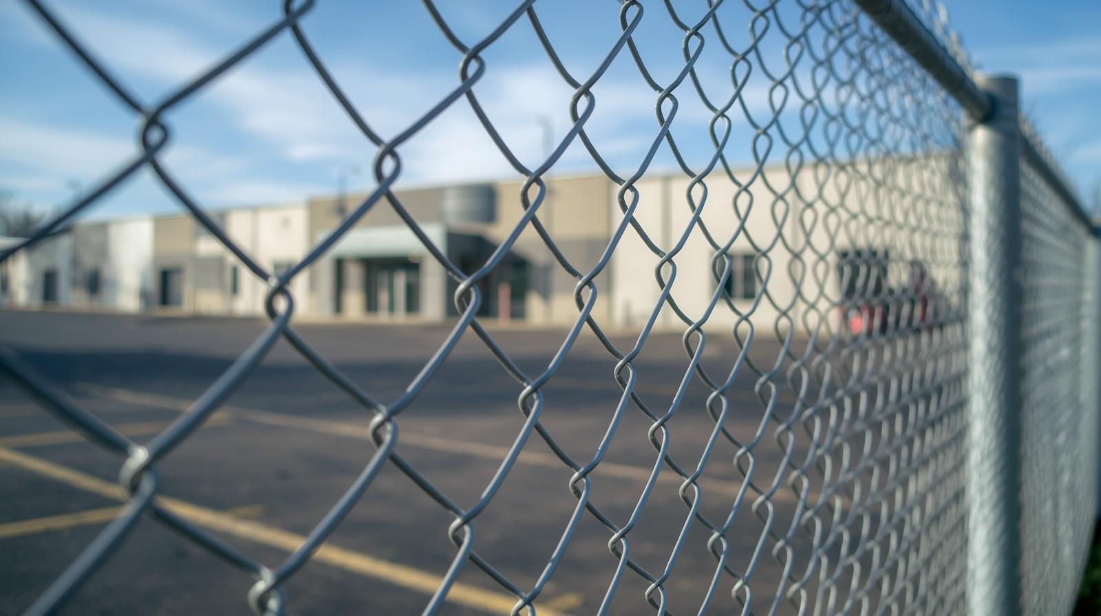 Commercial fence installation around business property in Hanover WI.