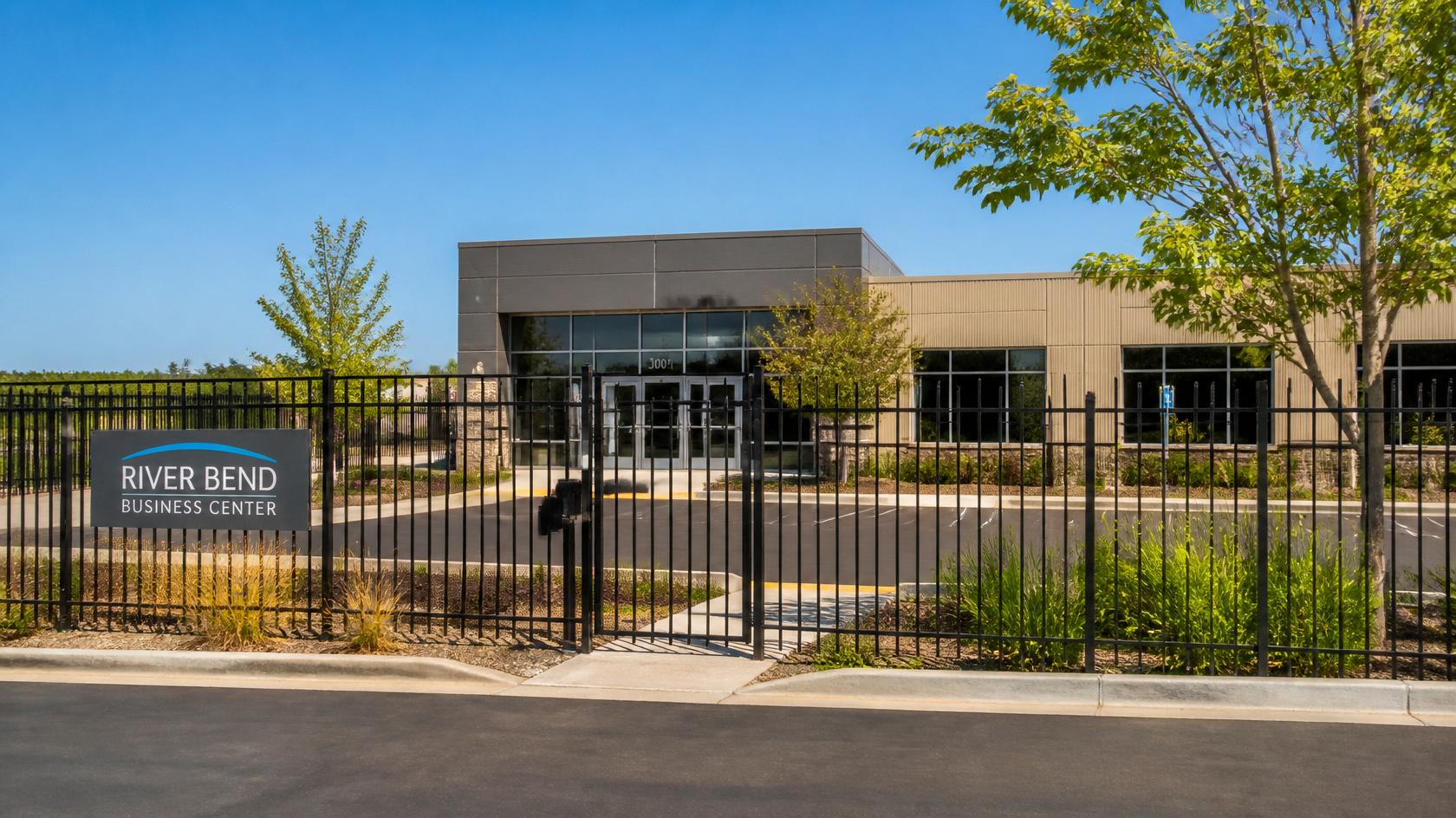 Commercial fence installation with secure access points on a business property in Janesville WI.