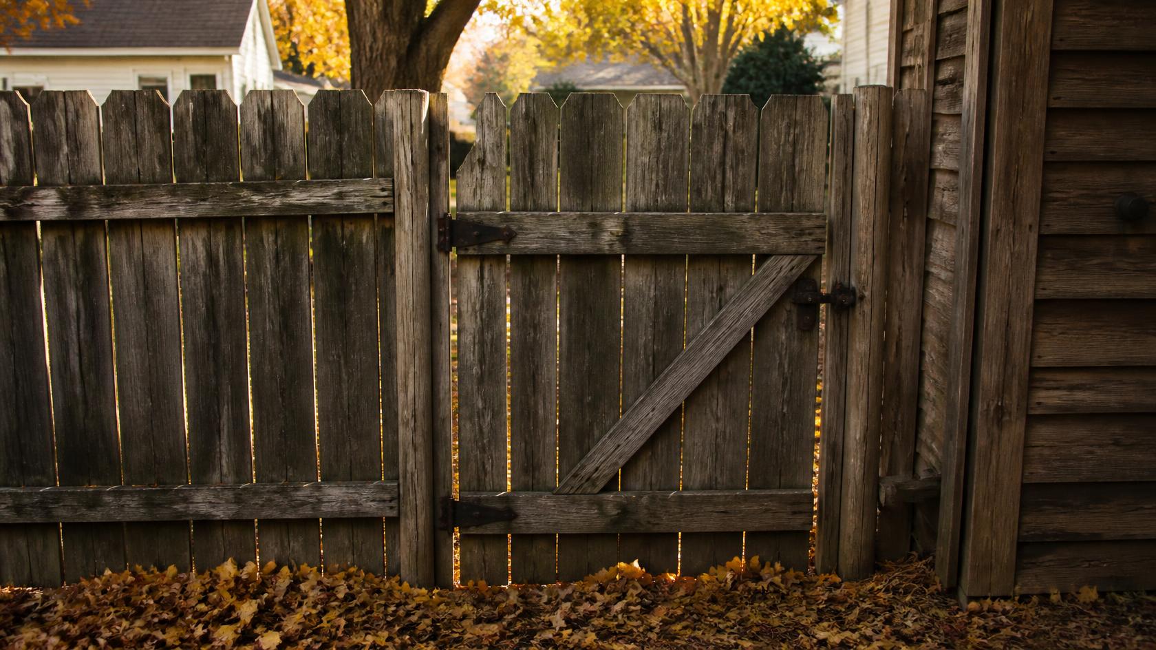 Fence gate in Orfordville, WI being inspected for sagging, alignment, latch, hardware, and other problems before winter.