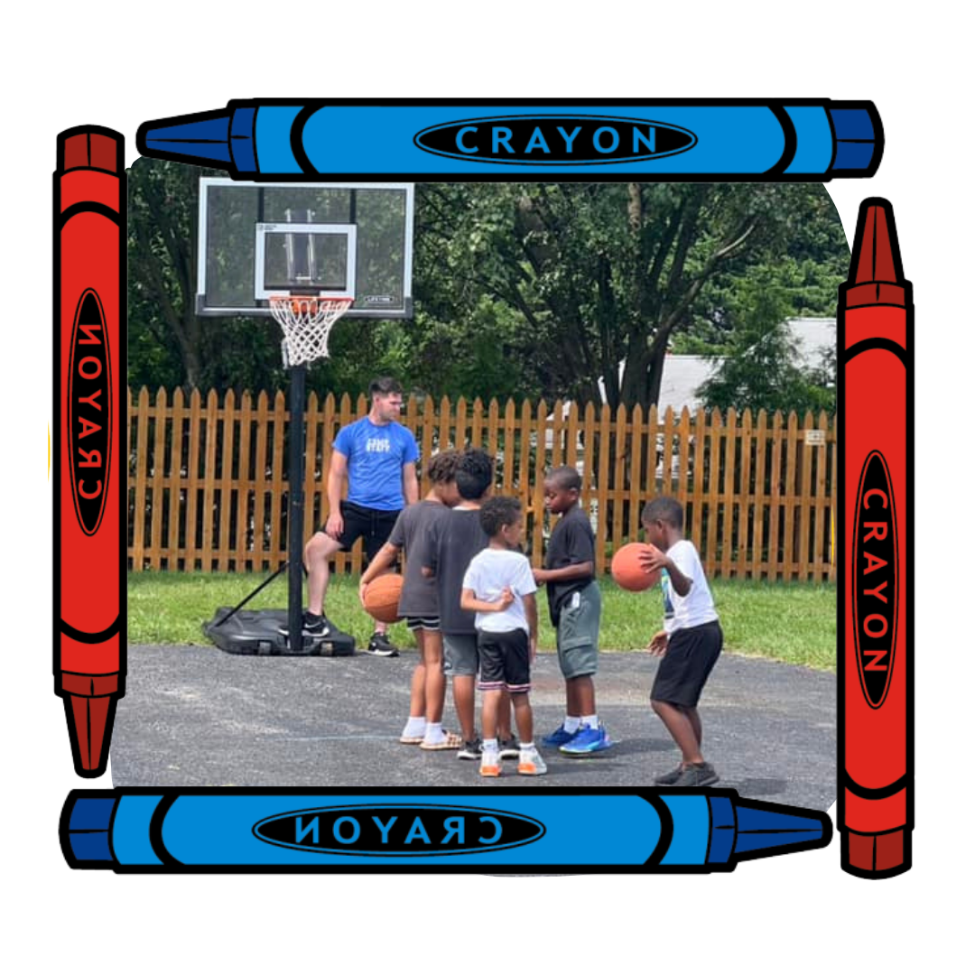 preschoolers playing basketball outside