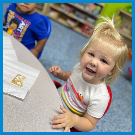 toddlers playing outside in center