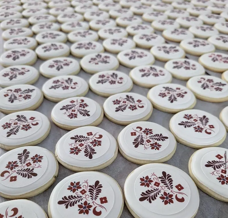Edible image cookie toppers applied to decorated sugar cookies