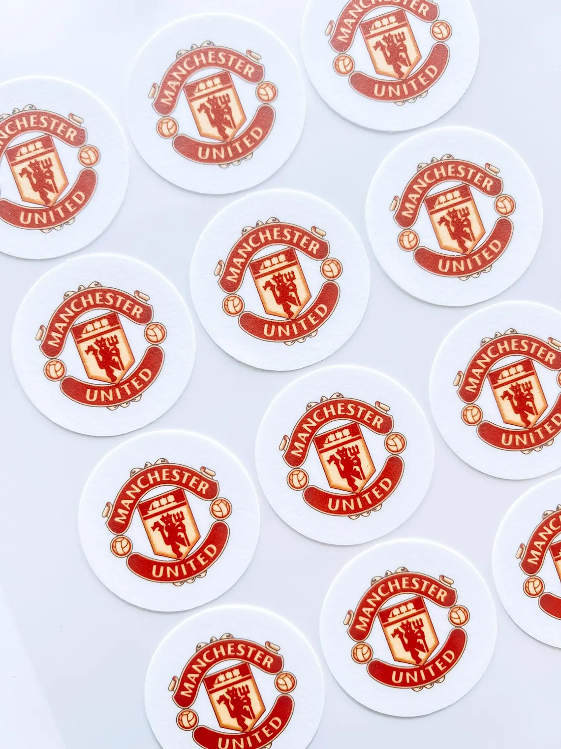 Custom edible cookie toppers with printed designs on iced cookies