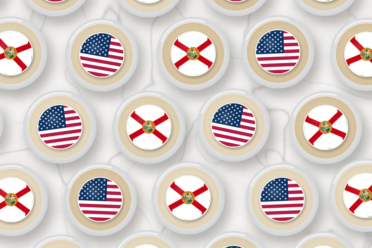 Cocktails topped with edible drink toppers printed with the Florida flag and the American flag
